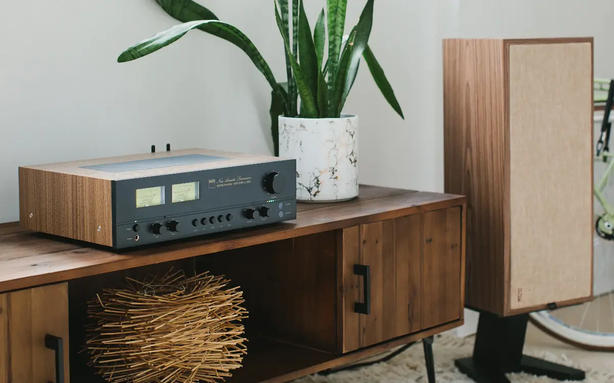 PSB Passif 50 speakers on stands with a vintage-inspired NAD amplifier